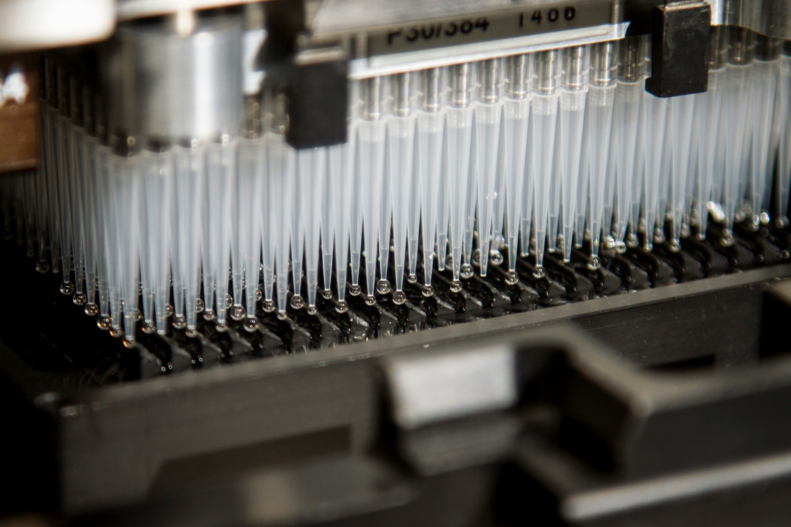Pipette tips in rack for Cyro-Weld™ medical cyanoacrylate sensor and component bonding
