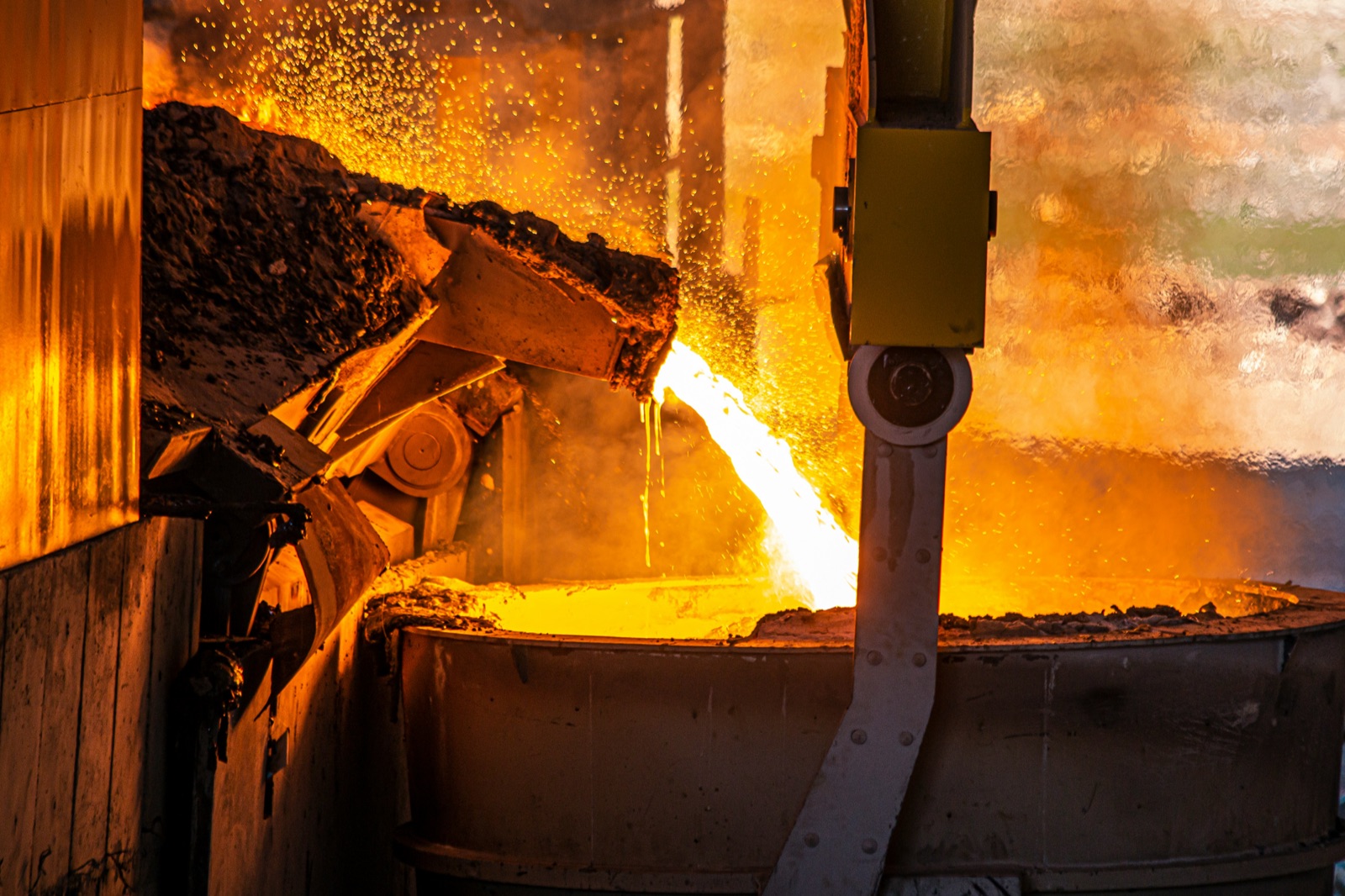 Molten metal tapped from industrial blast furnace with refractory lining visible for Epo-Weld™ HTCP putty repair