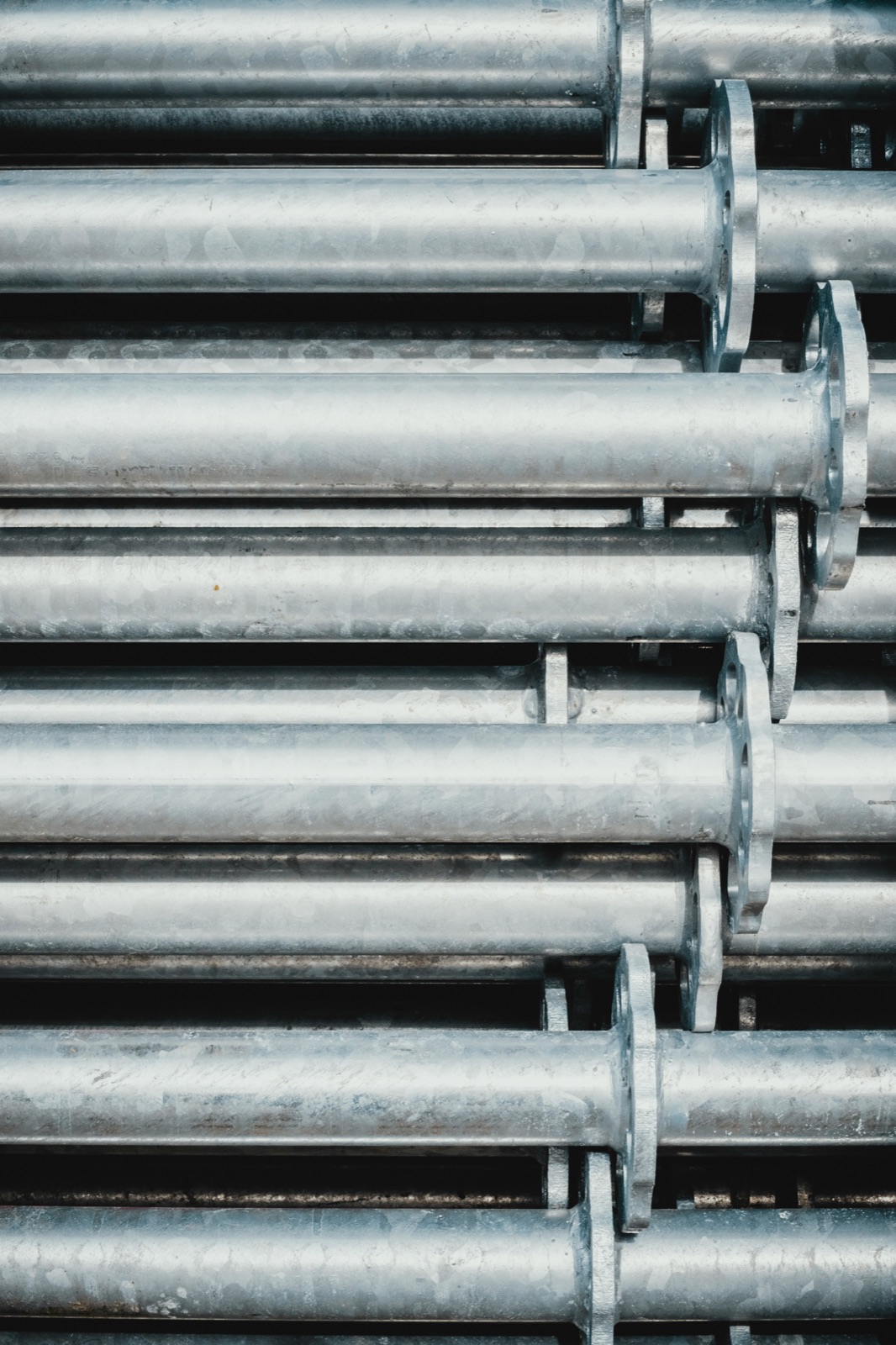 Gray steel rod lot in industrial setting for Epo-Weld™ HTE high-temperature epoxy surface rebuilding and repair
