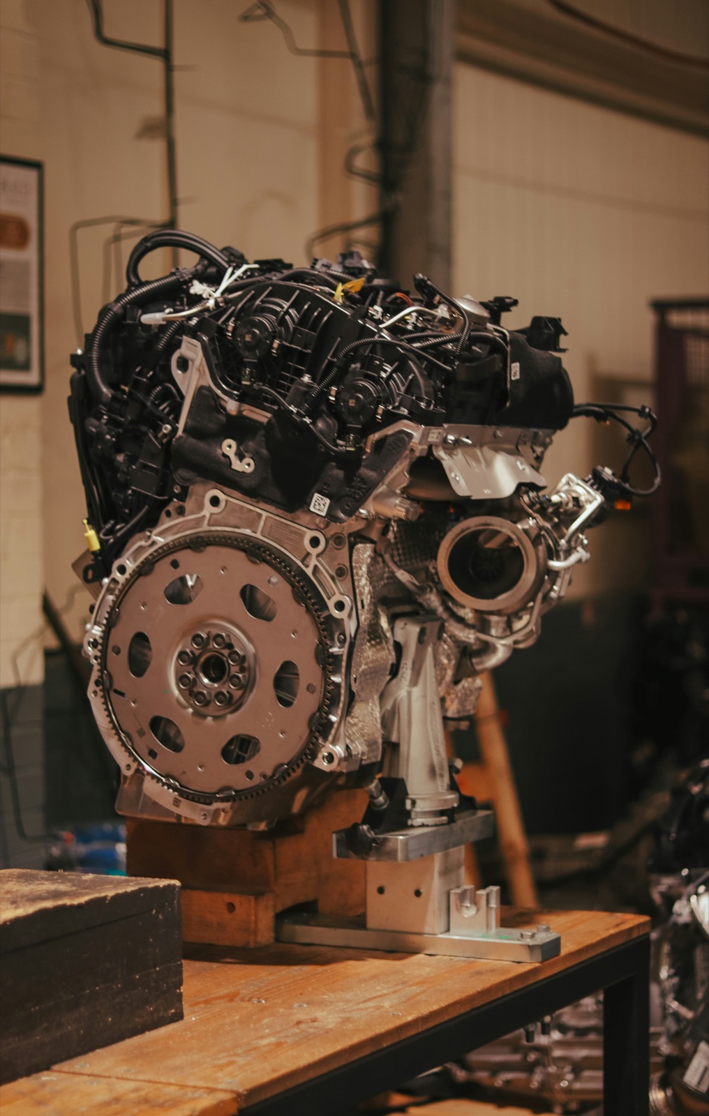 Automotive engine assembly on a stand for Epo-Weld™ UHTE ultra high temperature epoxy automotive and industrial potting