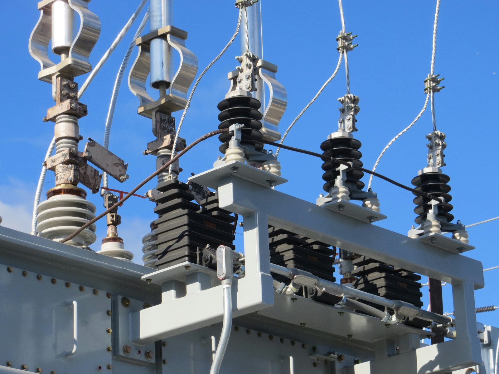 Gray transmission tower electrical infrastructure for Epo-Weld™ UHTE ultra high temperature epoxy high voltage