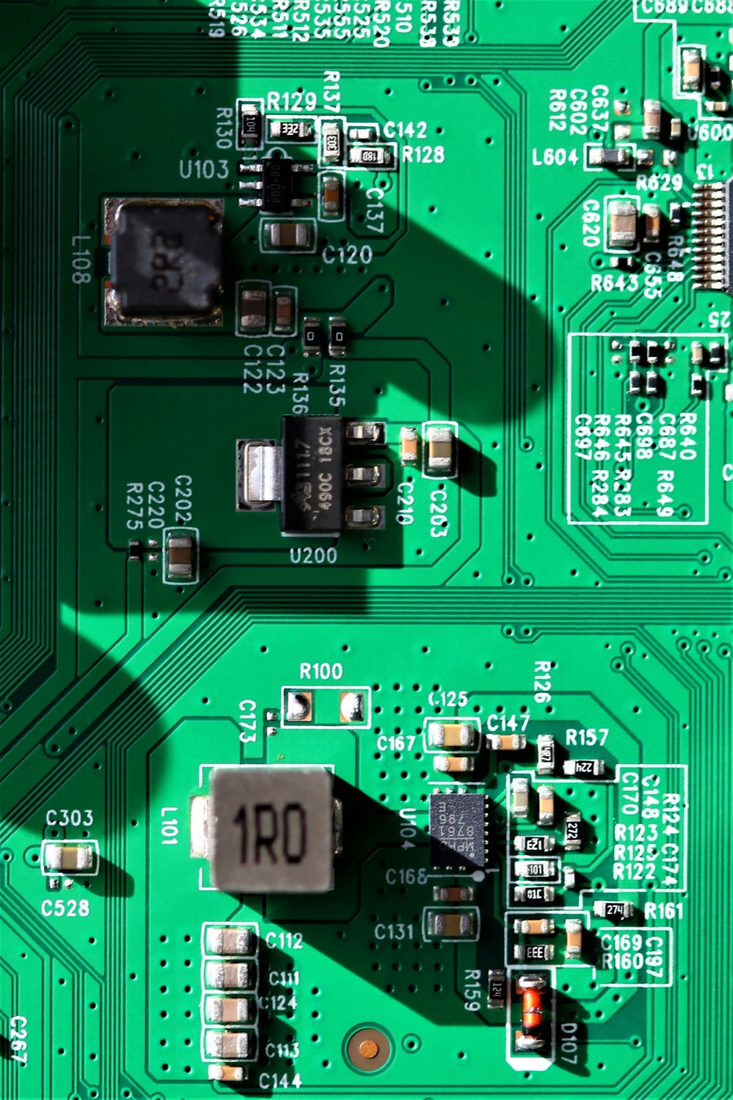Green PCB with SMD components coated with Ultra-Illumina™ UV conformal coating for moisture protection