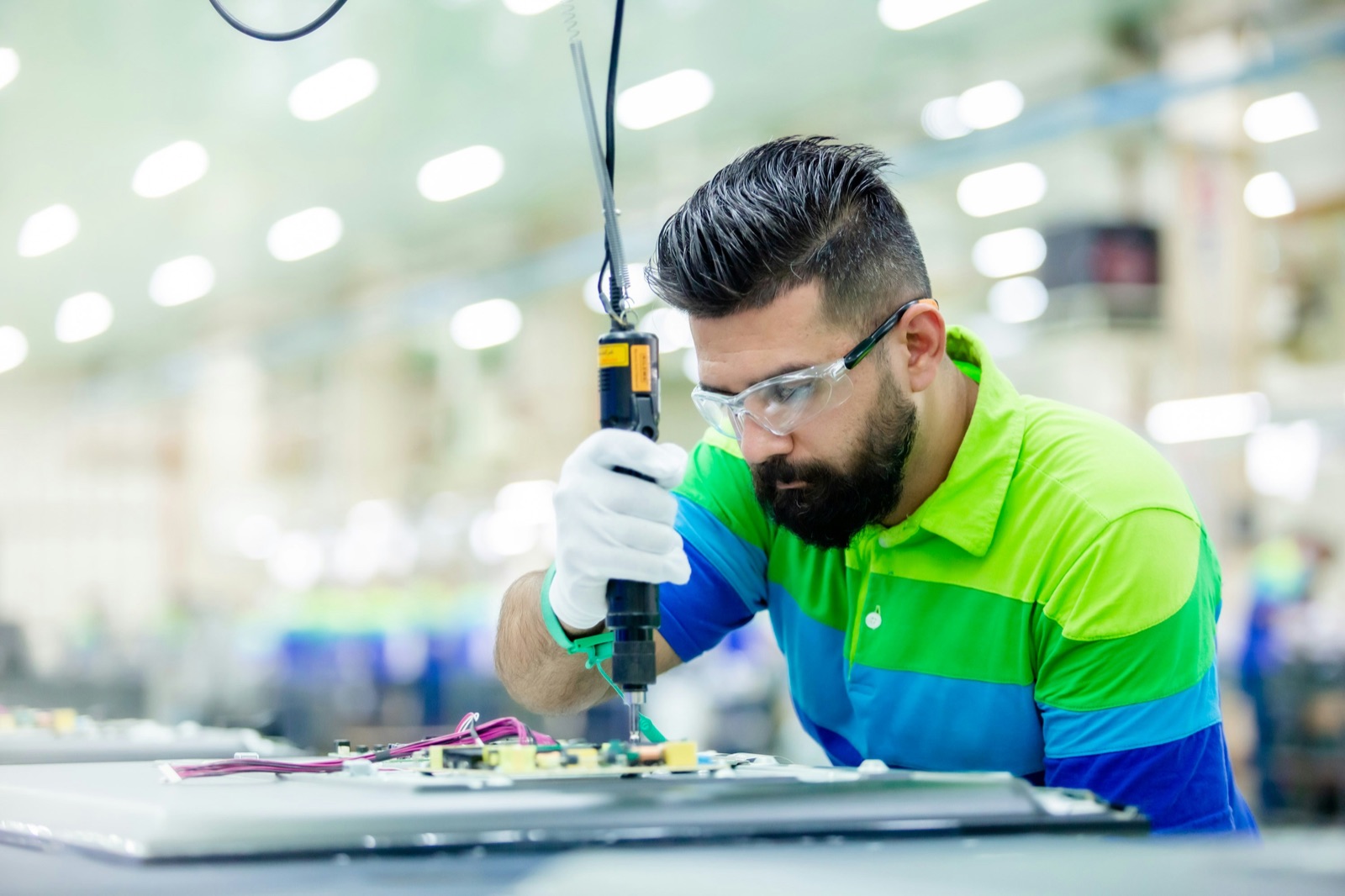 PCB conformal coating cure on electronics production floor for Incure L-Series™ UV LED flood lamp electronics assembly