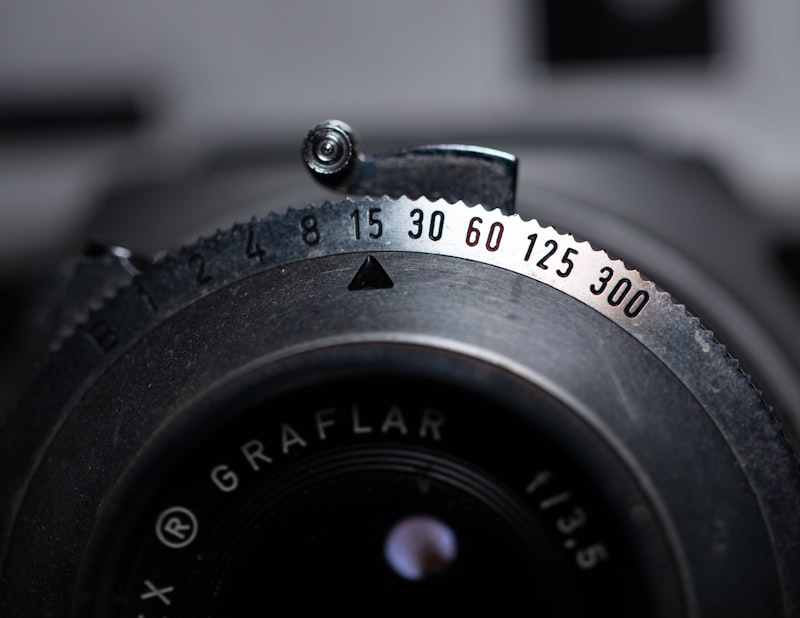 Close-up of camera lens aperture ring and optical elements for Optik™ UV lens bonding and doublet assembly
