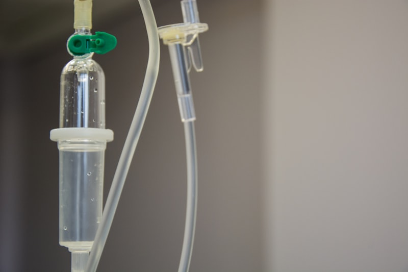 Clear medical IV plastic tubing with green connector for Uni-Weld™ UV plastic bonder medical device manufacturing