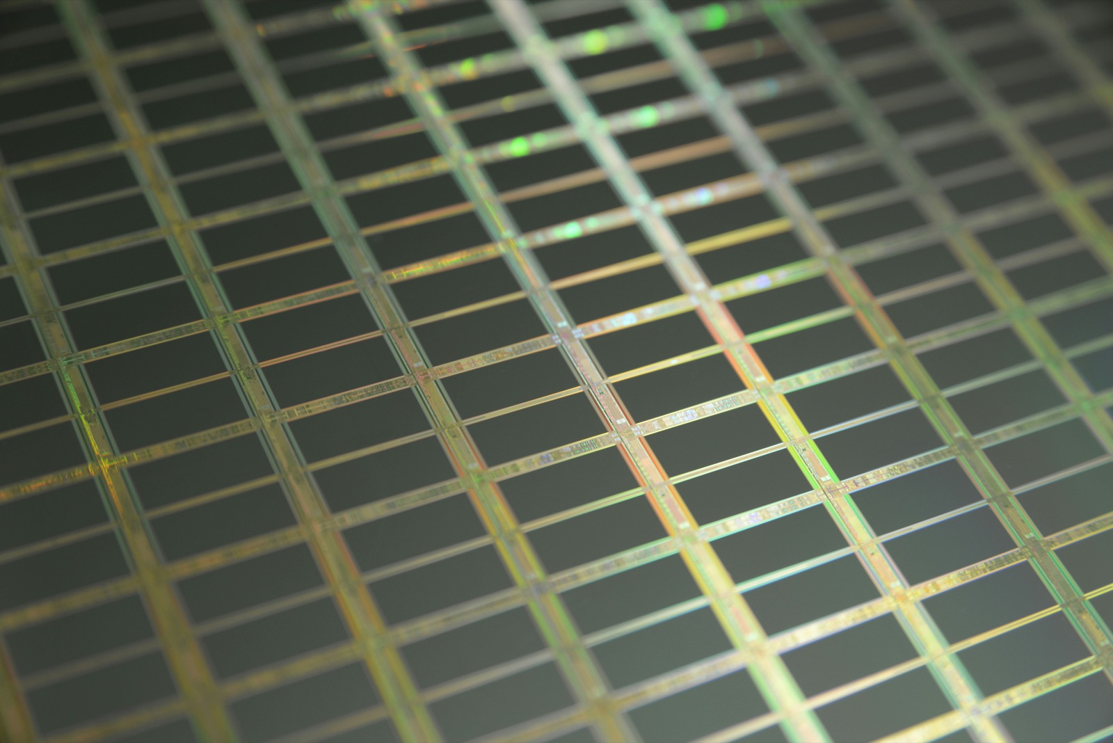 Silicon wafer die grid showing semiconductor circuit patterns for Pyra-Sil™ UV silicone conformal coating on PCBA